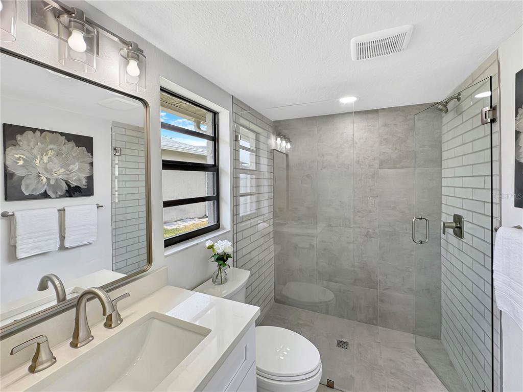 Undisclosed Address Port Richey, FL 34668 - Photo 27 of 44 a bathroom with a sink toilet and shower