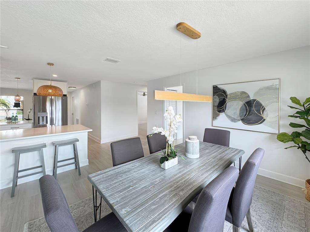 Undisclosed Address Port Richey, FL 34668 - Photo 33 of 44 a view of a dining room with furniture