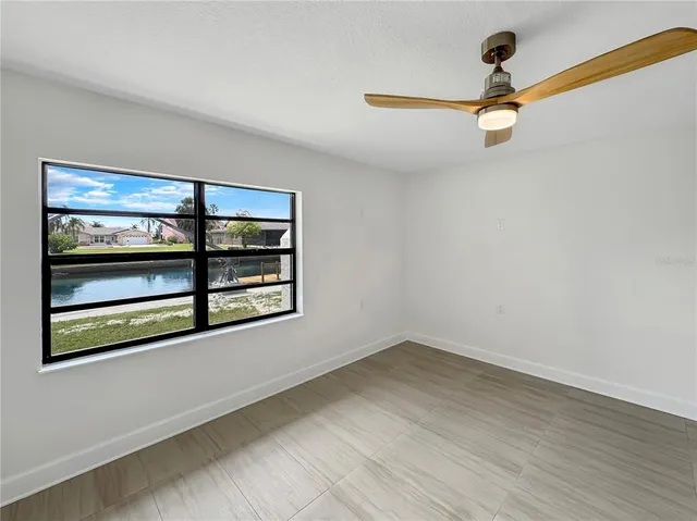 a view of a room with rack on the wall and a window