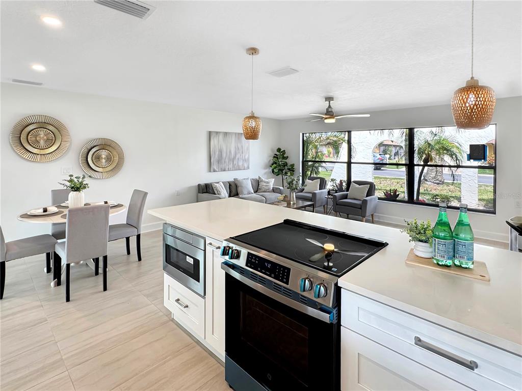 Undisclosed Address Port Richey, FL 34668 - Photo 35 of 44 a kitchen with a stove and a table