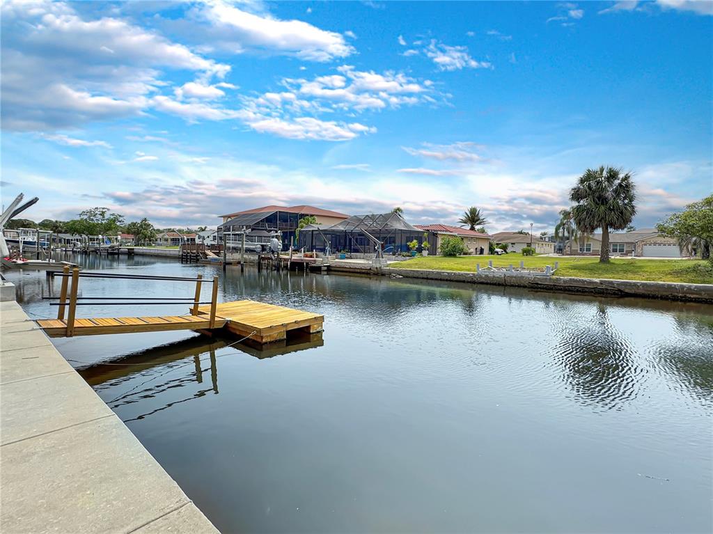 Undisclosed Address Port Richey, FL 34668 - Photo 41 of 44 a view of a lake with a nearby beach