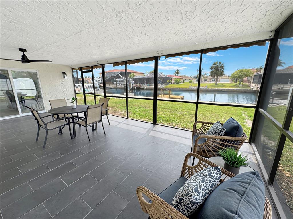 Undisclosed Address Port Richey, FL 34668 - Photo 10 of 44 a living room with furniture and a floor to ceiling window