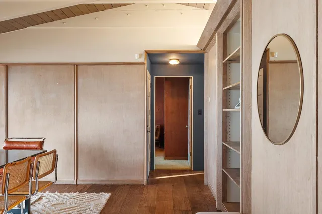 a living room with furniture a fireplace and a table