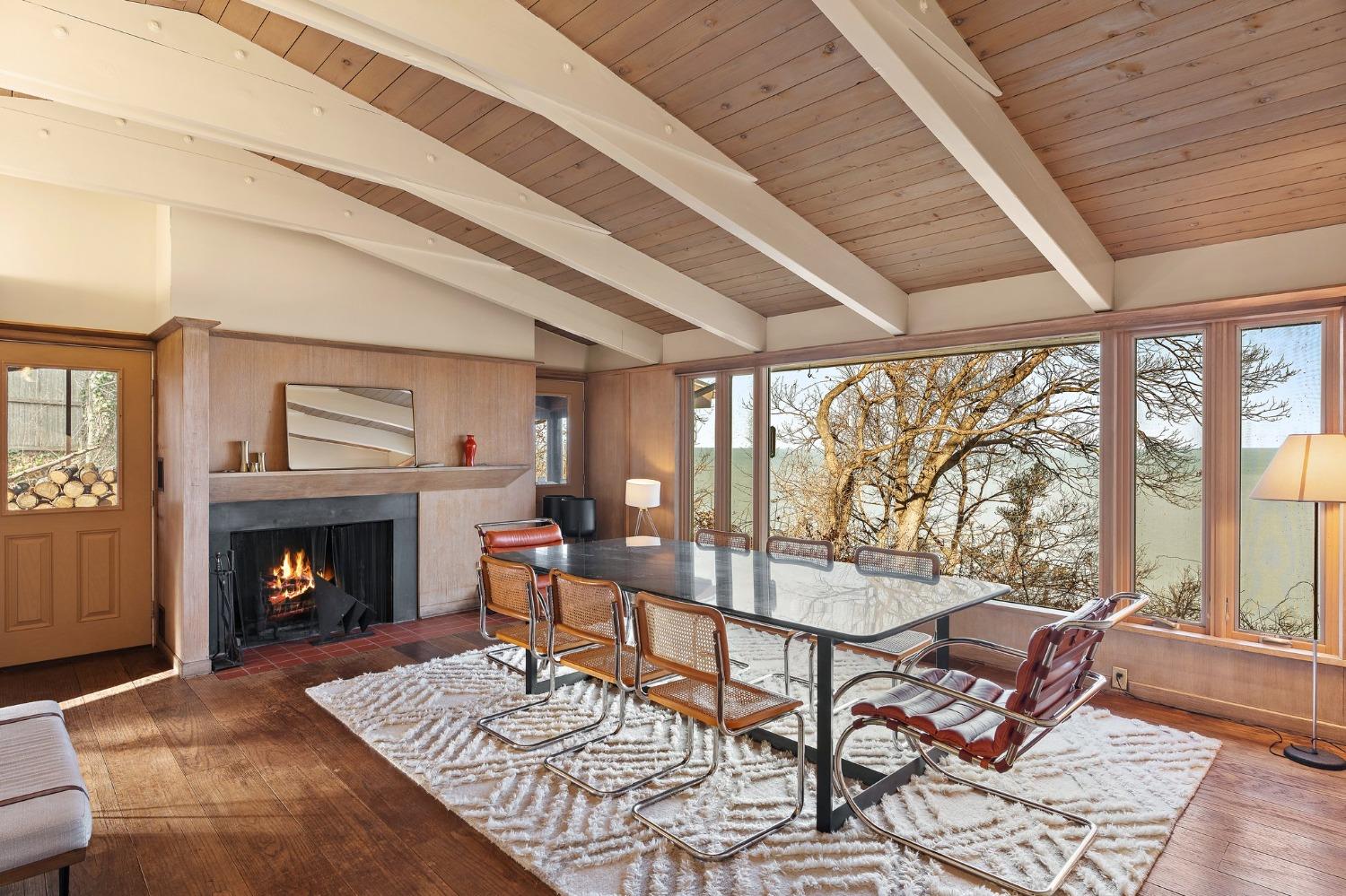 42 Circle Drive Dune Acres, IN 46304 - Photo 20 of 44 a living room with furniture a fireplace and a table