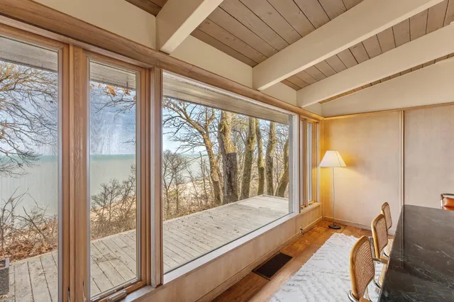 a kitchen with a window a sink and cabinets