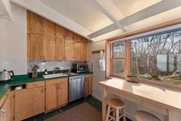 a bathroom with a toilet a sink and bathtub