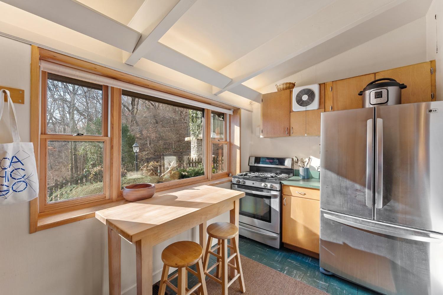 42 Circle Drive Dune Acres, IN 46304 - Photo 29 of 44 a kitchen with a stove a refrigerator and a stove top oven