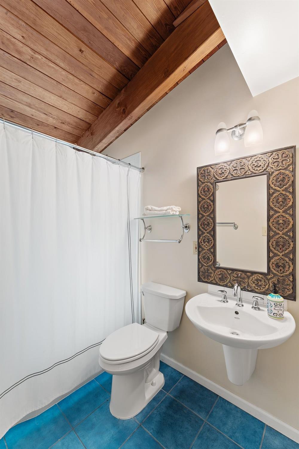 42 Circle Drive Dune Acres, IN 46304 - Photo 30 of 44 a bathroom with a toilet a sink and bathtub