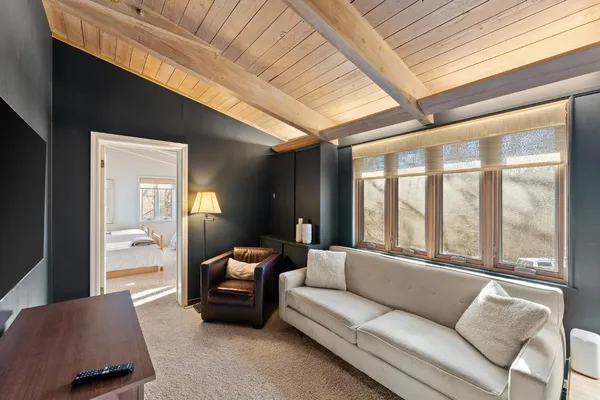 a bedroom with a large bed and a window