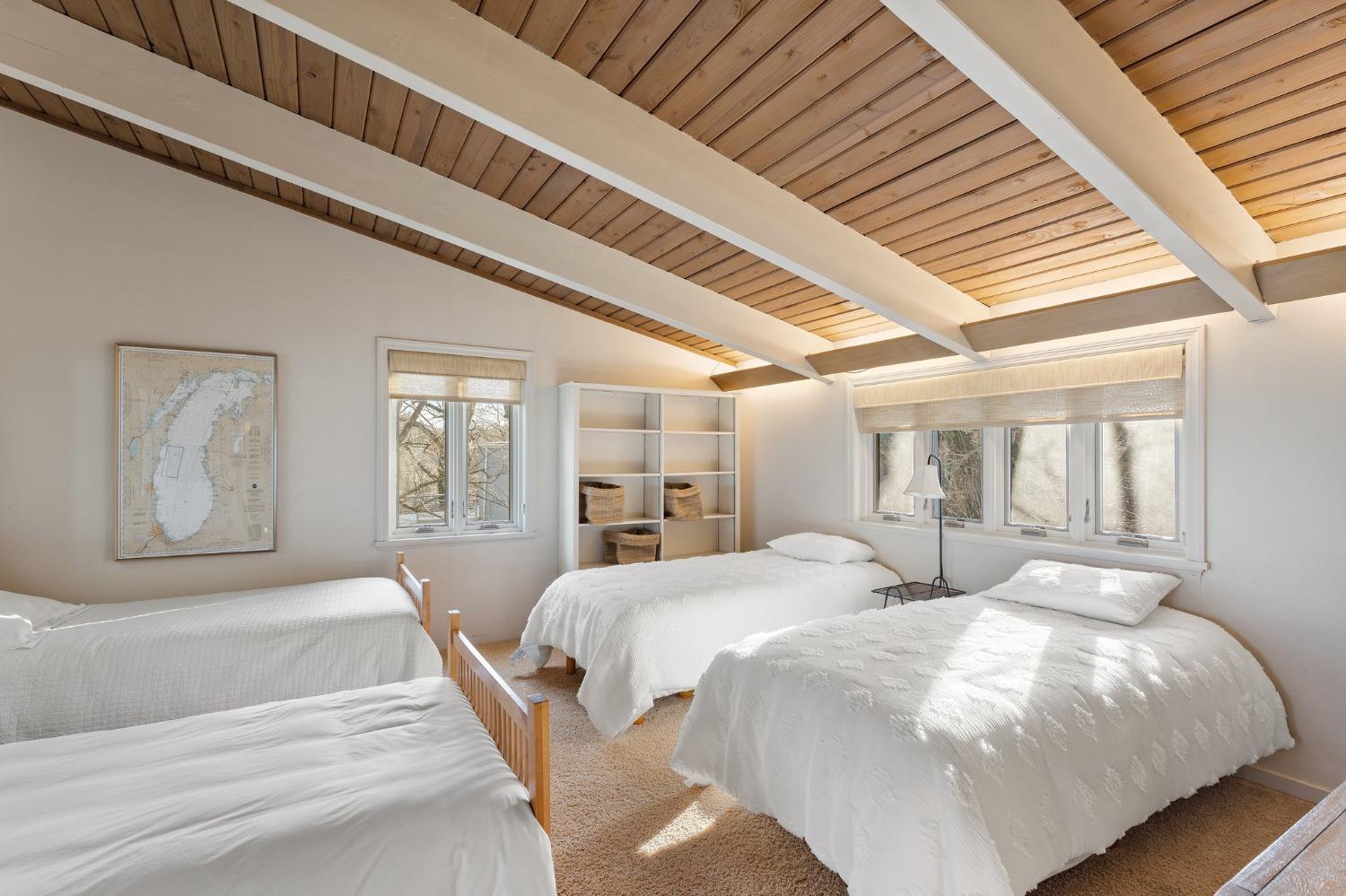 42 Circle Drive Dune Acres, IN 46304 - Photo 34 of 44 a bedroom with double bed and a large window