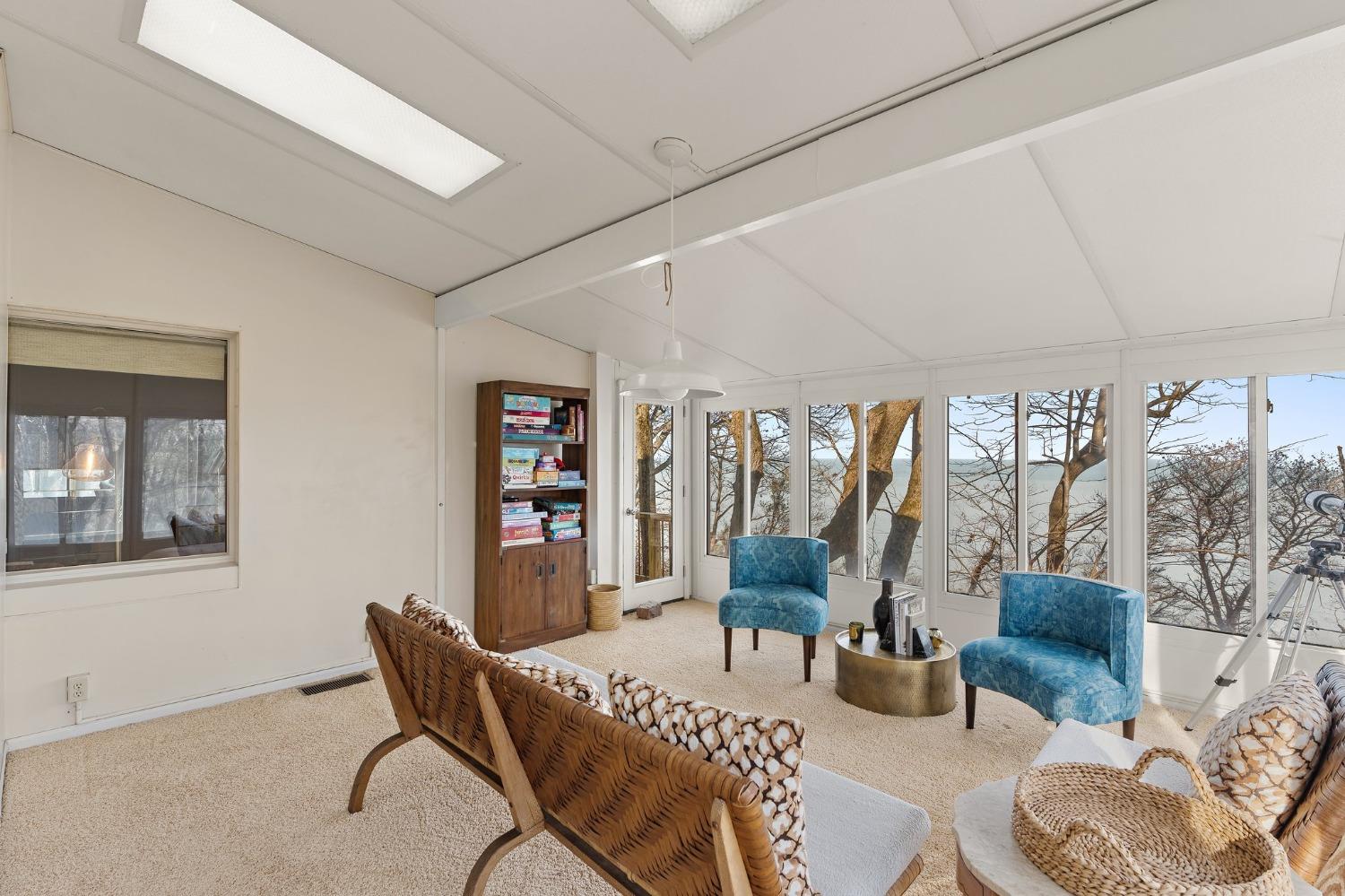 42 Circle Drive Dune Acres, IN 46304 - Photo 37 of 44 a living room with furniture a flat screen tv and a large window