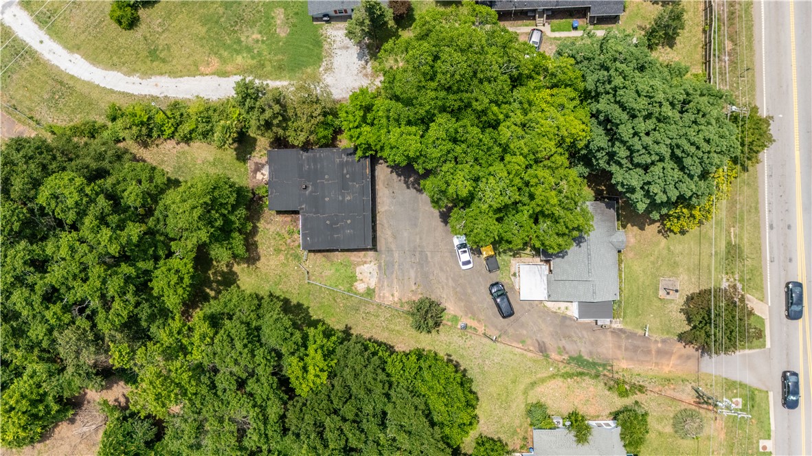608 29 N Bypass Anderson, SC 29621 - Photo 17 of 20 An aerial perspective reveals a property framed by mature trees, offering privacy and a verdant setting.