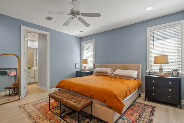 a bedroom with a bed and a table