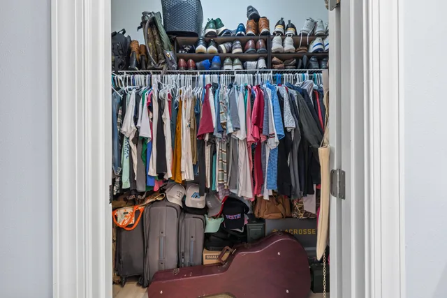 a bedroom with furniture and window