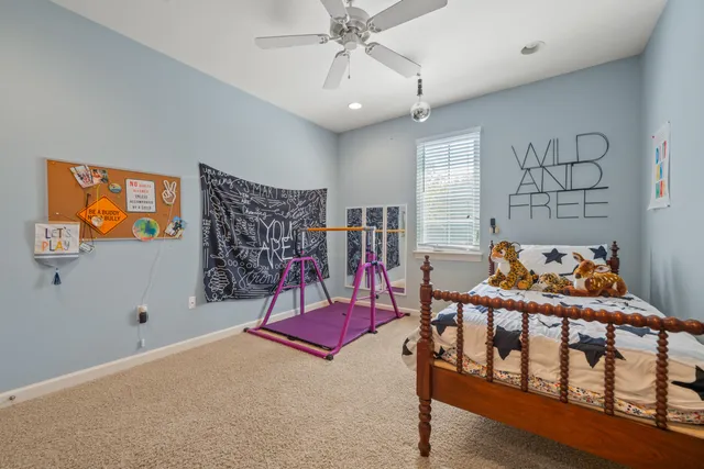 a bed room with a bed and a television