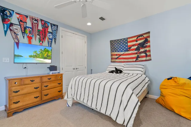 a bedroom with a bed and furniture