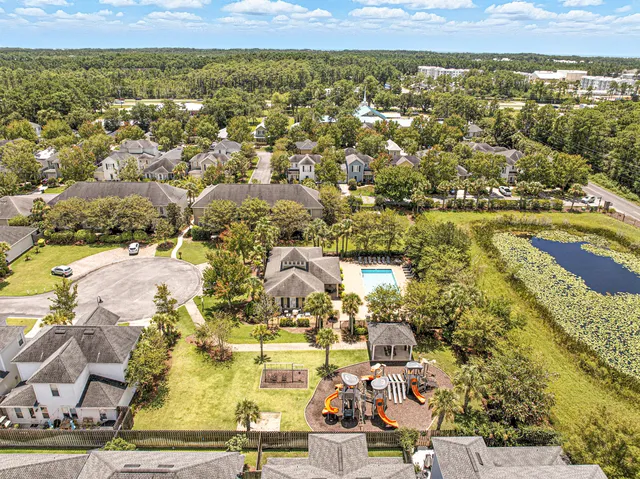 an aerial view of residential houses with outdoor space