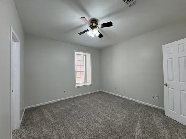 a white toilet sitting next to a bath tub