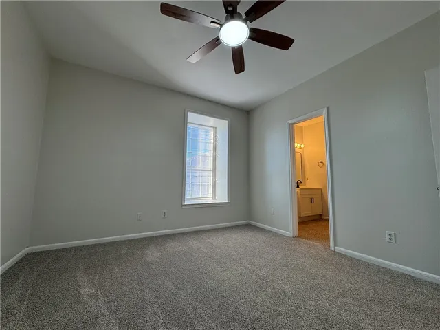 a view of a hallway with wooden shelves