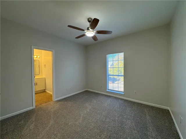 wooden view of a bathroom from a hallway