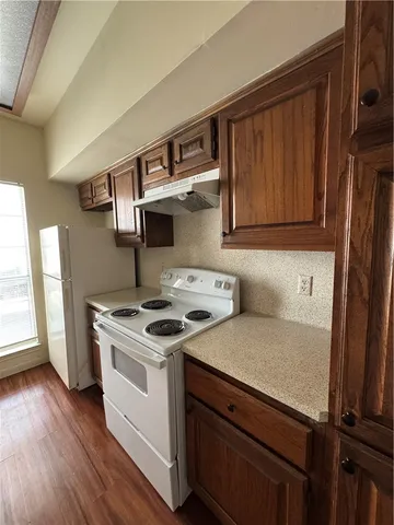 a kitchen with a stove and a microwave