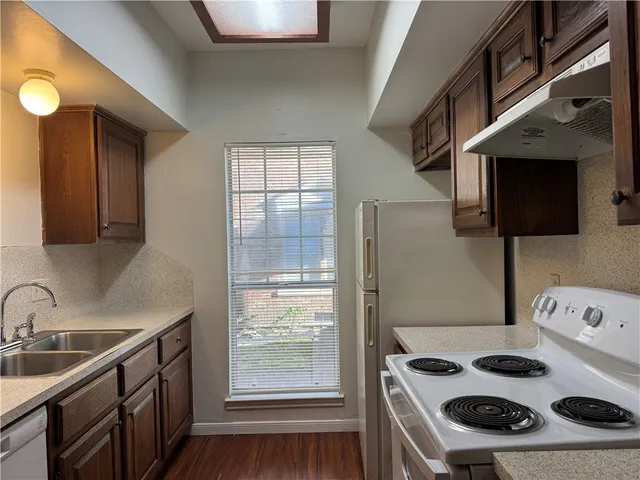 a kitchen with a stove and a sink
