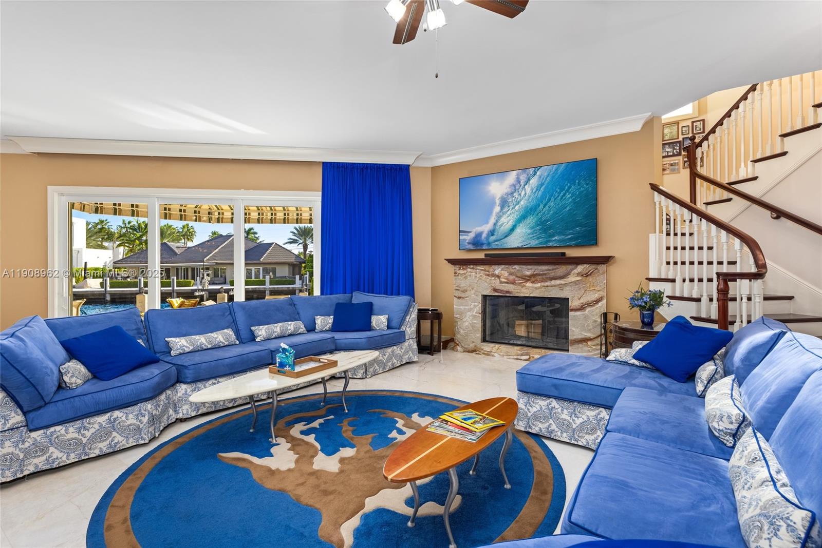 70 Bay Colony Lane Fort Lauderdale, FL 33308 - Photo 17 of 97 a living room with furniture a fireplace and a flat screen tv