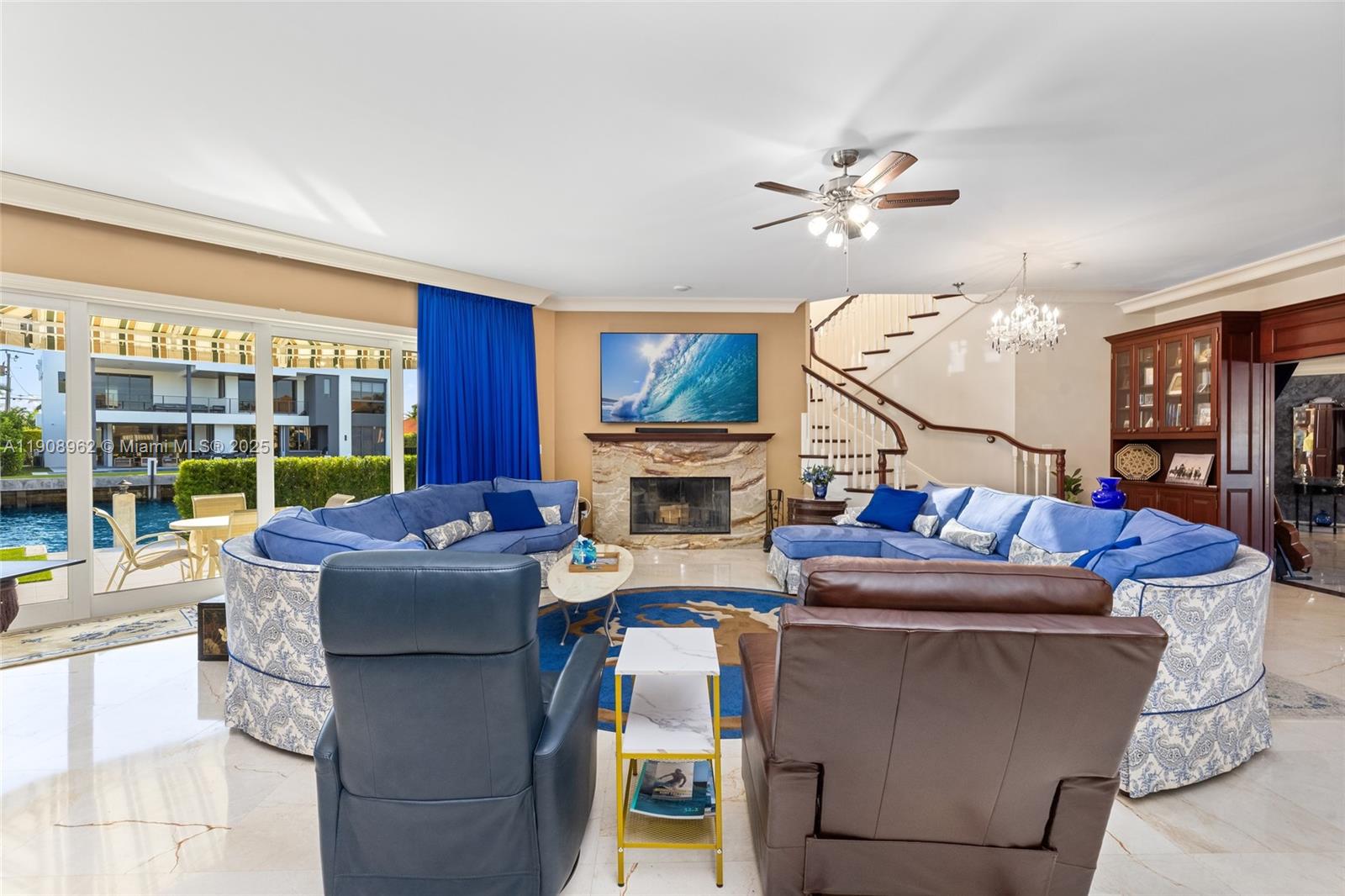70 Bay Colony Lane Fort Lauderdale, FL 33308 - Photo 19 of 97 a living room with fireplace furniture and a large window