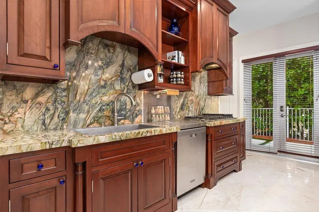 a view of a chairs and table in a backyard