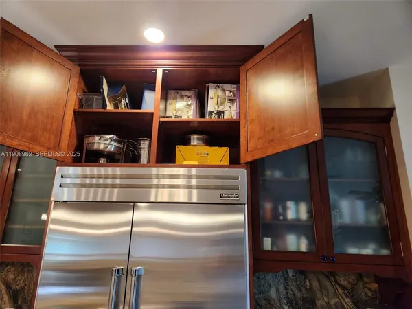 a bathroom with a granite countertop sink a toilet and a mirror