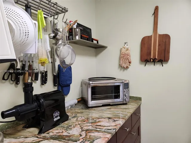 a living room with a mirror and a chandelier