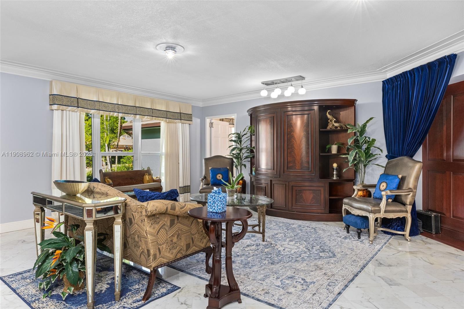 70 Bay Colony Lane Fort Lauderdale, FL 33308 - Photo 45 of 97 a living room with furniture and a fireplace