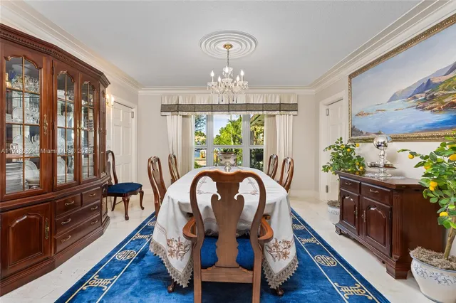 a spacious bedroom with a bed and a chandelier