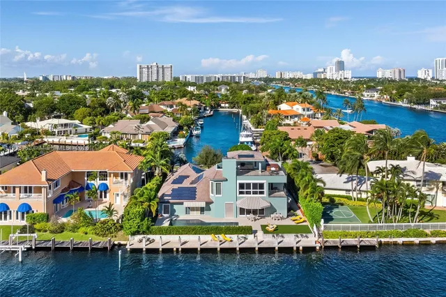 a front view of a house with swimming pool garden and patio