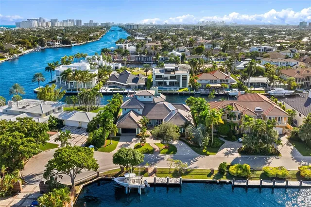 a view of a chair and tables in the patio and a fountain