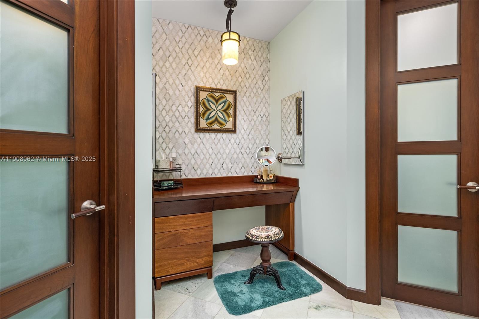 70 Bay Colony Lane Fort Lauderdale, FL 33308 - Photo 65 of 97 a room with painting on the wall and a potted plant