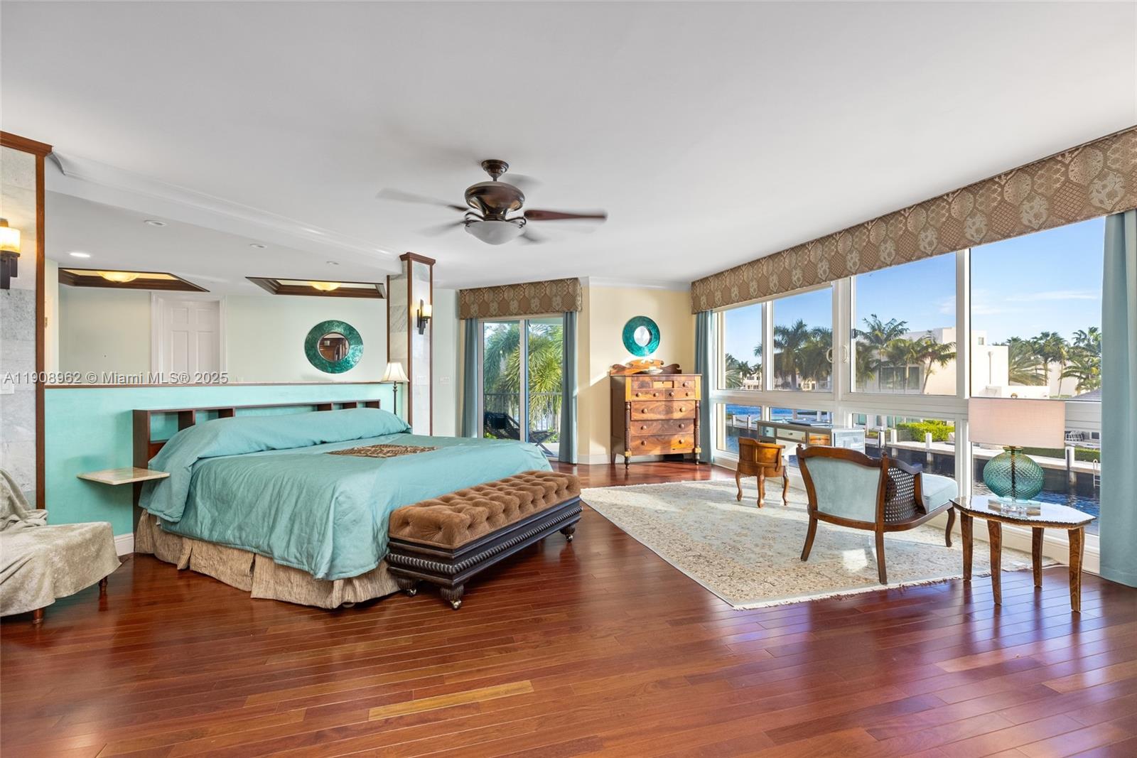 70 Bay Colony Lane Fort Lauderdale, FL 33308 - Photo 71 of 97 a bedroom with a bed and large windows