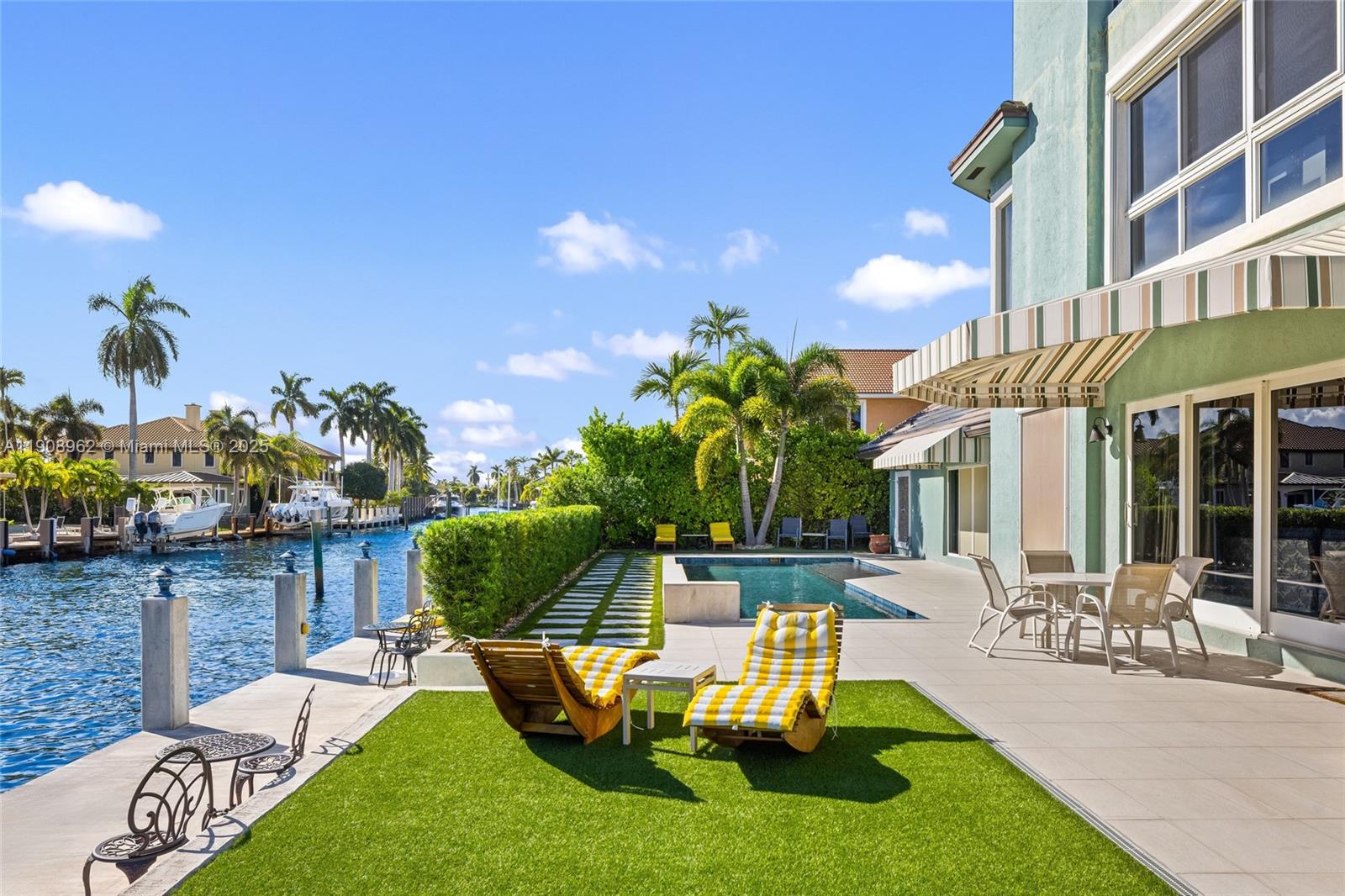 70 Bay Colony Lane Fort Lauderdale, FL 33308 - Photo 80 of 97 a front view of a house with swimming pool garden and patio