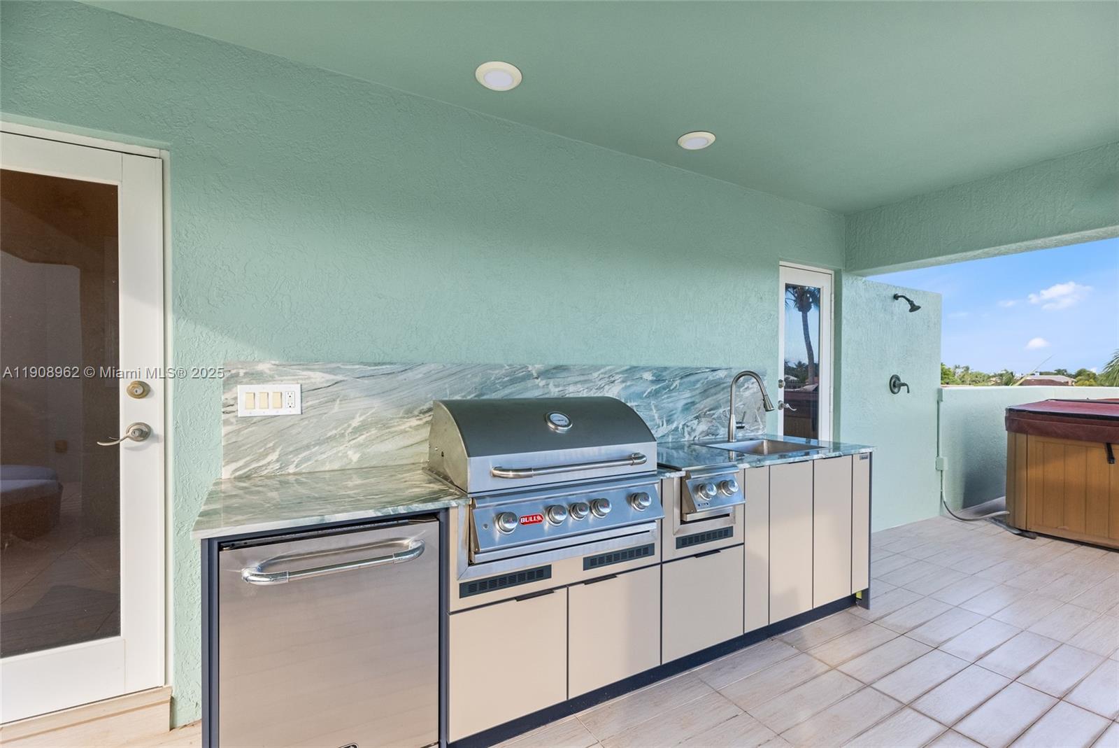 70 Bay Colony Lane Fort Lauderdale, FL 33308 - Photo 88 of 97 a kitchen with a stove and a refrigerator