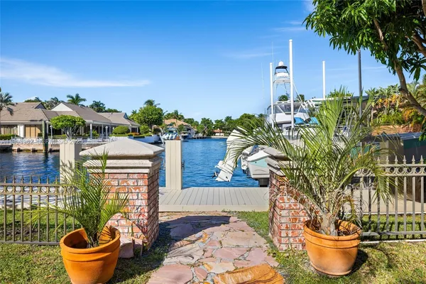 a living room with furniture fireplace and a large window