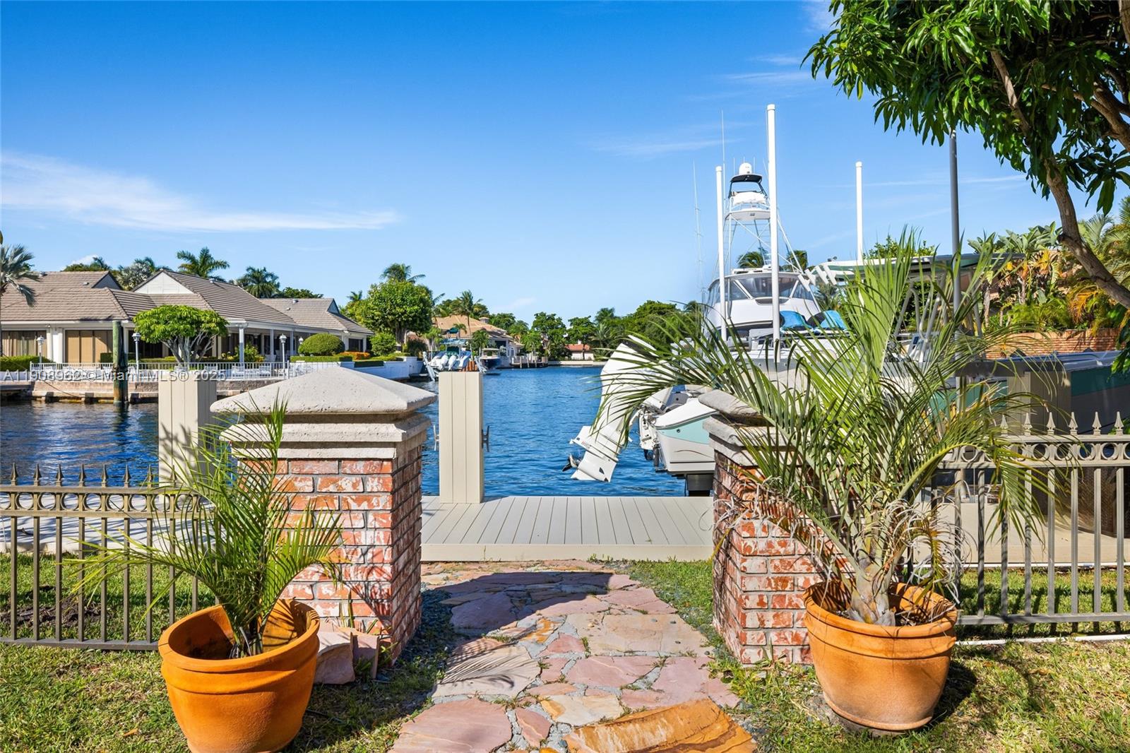 70 Bay Colony Lane Fort Lauderdale, FL 33308 - Photo 9 of 97 a outdoor view with a seating space and potted plants