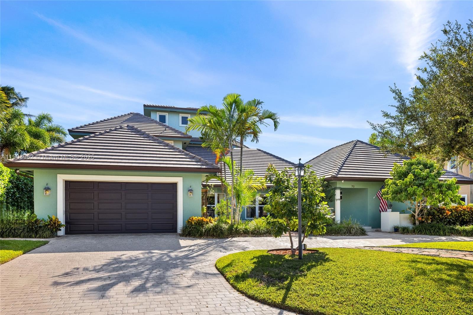 70 Bay Colony Lane Fort Lauderdale, FL 33308 - Photo 10 of 97 a front view of a house with a yard