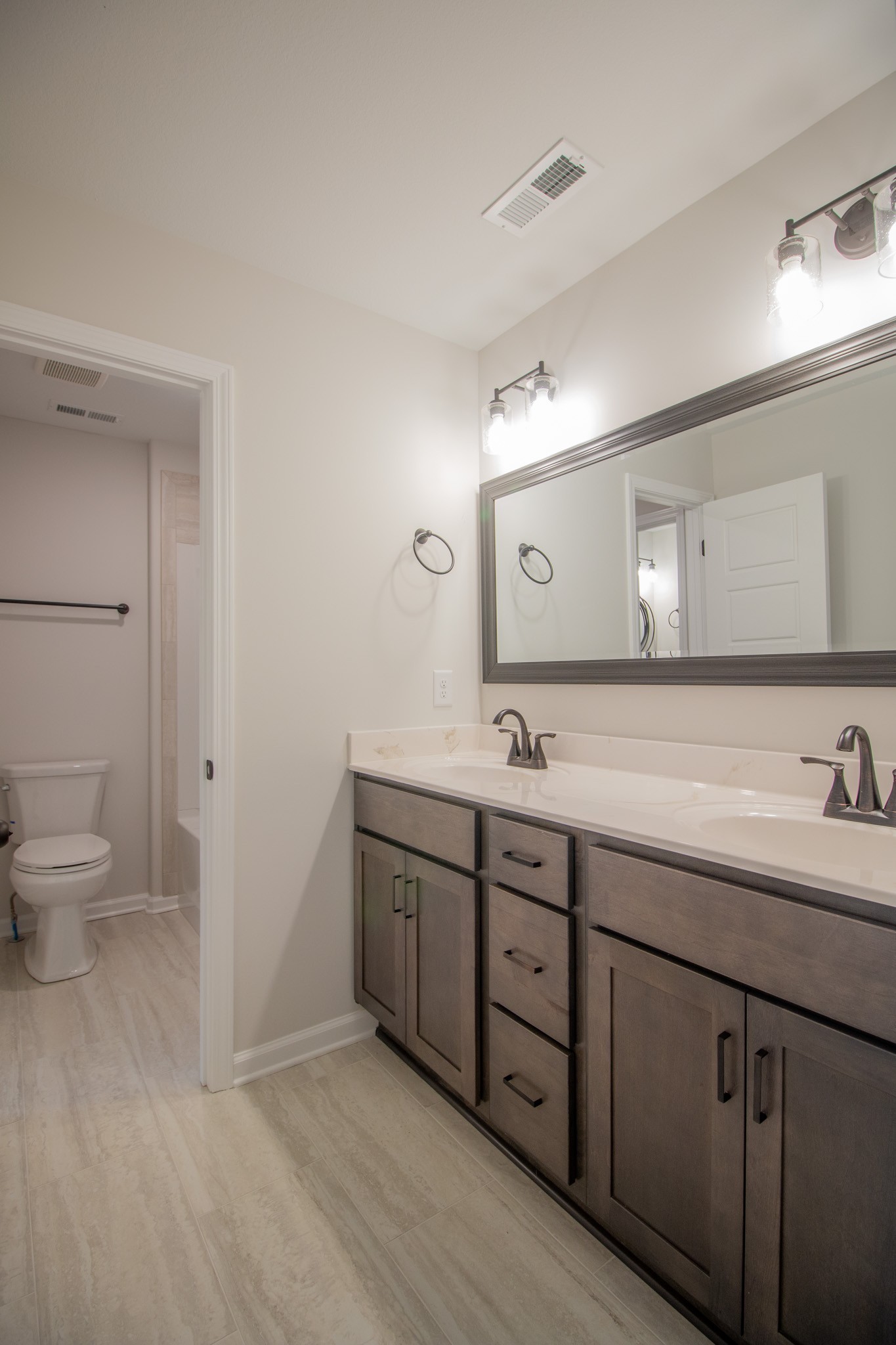362 Timber Springs Clarksville, TN 37042 - Photo 18 of 24 a spacious bathroom with a double vanity sink toilet and mirror