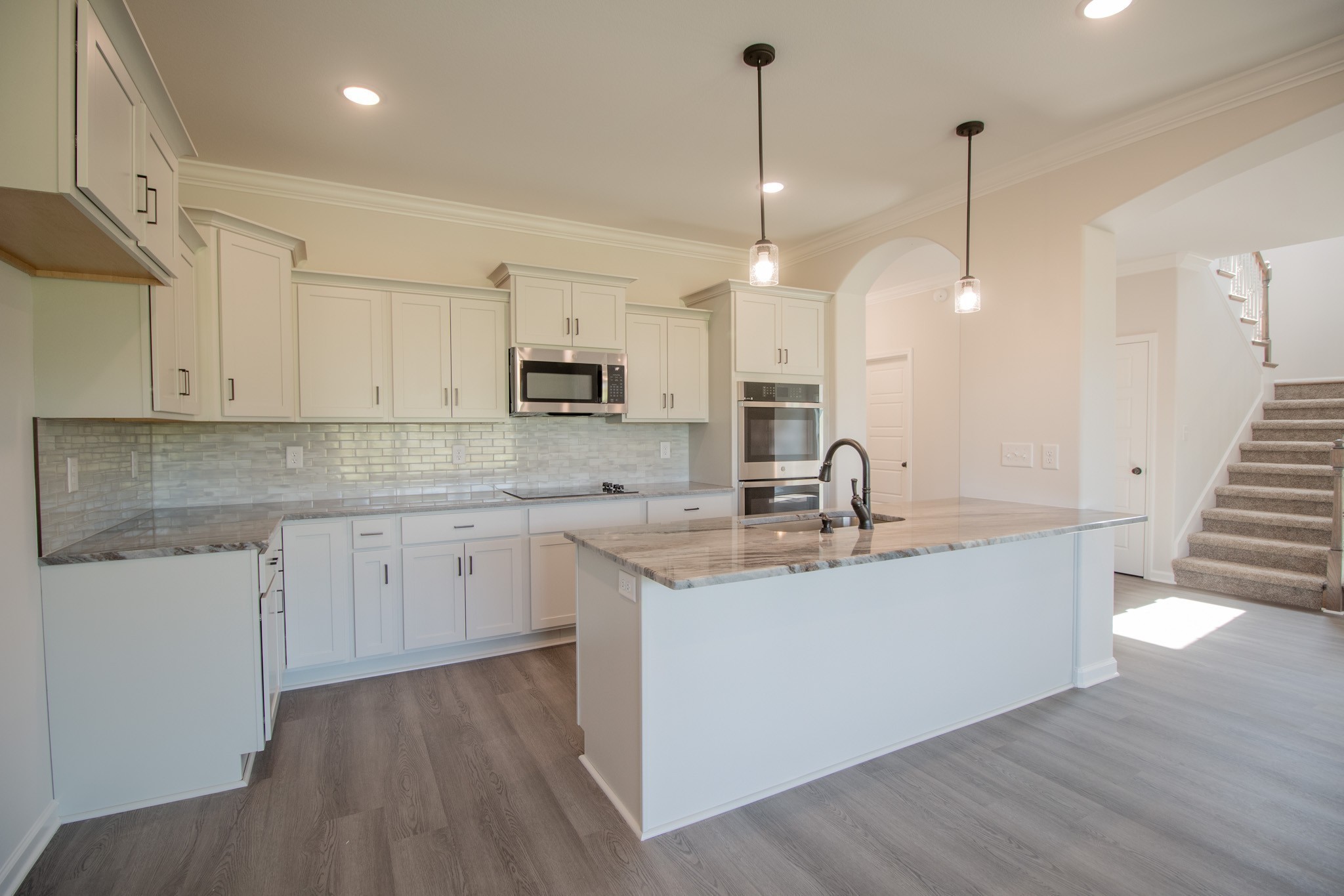 362 Timber Springs Clarksville, TN 37042 - Photo 6 of 24 a kitchen with kitchen island granite countertop a sink a counter space appliances and cabinets