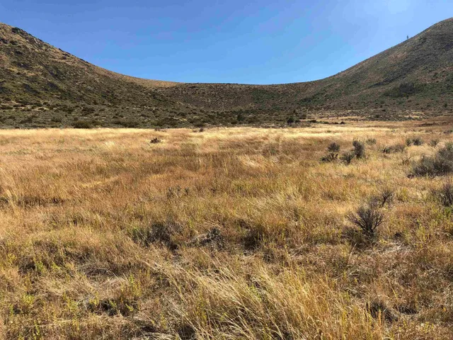 a view of ocean with mountain