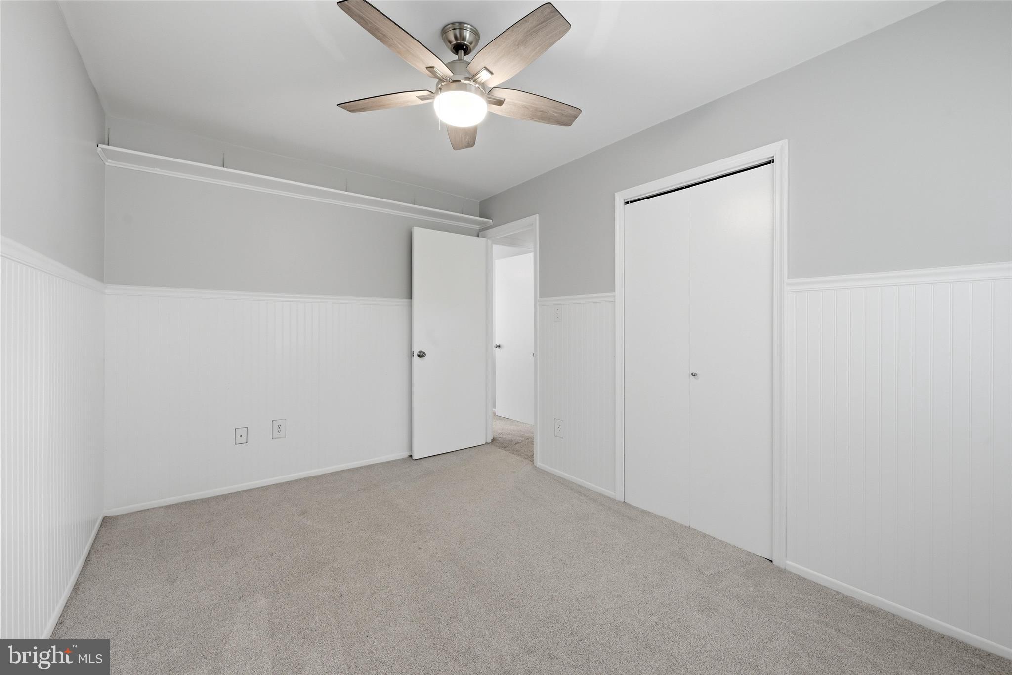 5446 Lighthouse Lane Burke, VA 22015 - Photo 20 of 36 an empty room with a ceiling fan and a window