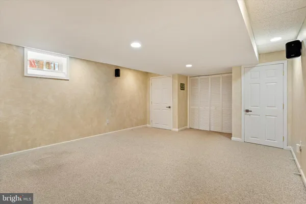 a view of kitchen with microwave and cabinets