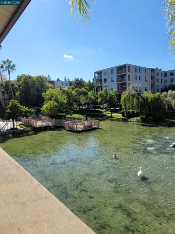 a view of a backyard with sitting area