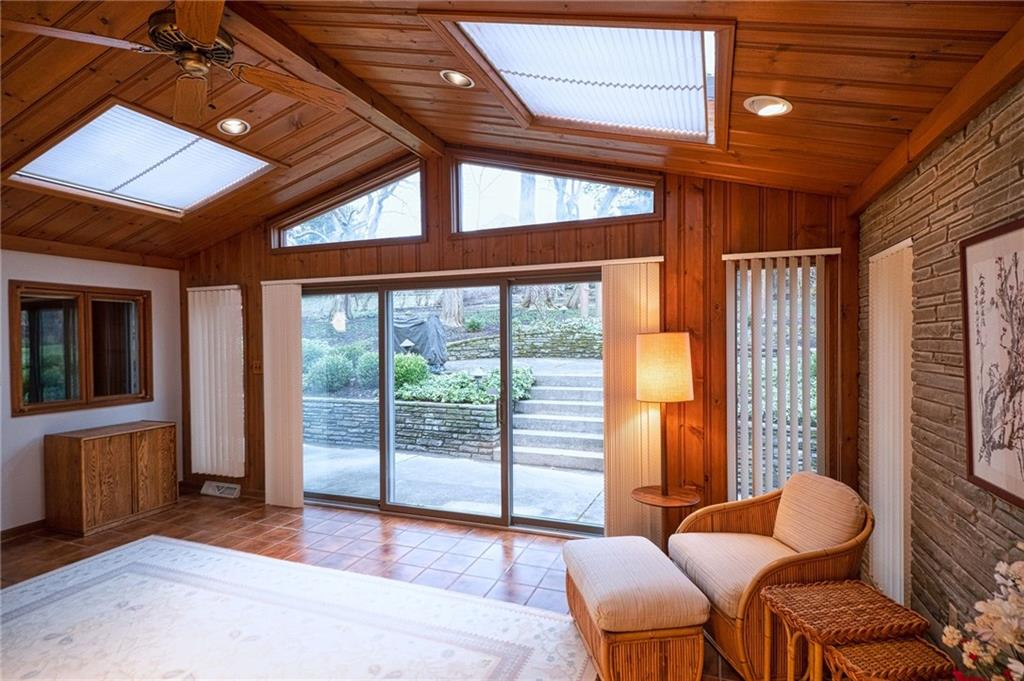 788 Elm Spring Road Pittsburgh, PA 15243 - Photo 13 of 25 All-season sun room with Italian tile floor, wall of windows/doors, sky-lights, and handy pass-through to kitchen.