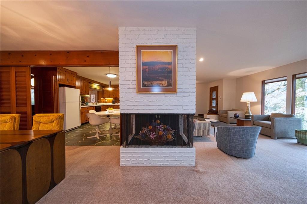 788 Elm Spring Road Pittsburgh, PA 15243 - Photo 8 of 25 Great circular flow! Cool three-sided fireplace (currently decorative).
